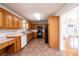 Traditional kitchen featuring oak cabinets, white appliances, and tile flooring at 538 30Th Avenue Ne Cir, Hickory, NC 28601