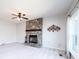 Cozy living room features stone fireplace, ceiling fan and natural light at 538 30Th Avenue Ne Cir, Hickory, NC 28601