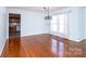 Open-concept living room with hardwood flooring and views of the adjacent kitchen area at 538 30Th Avenue Ne Cir, Hickory, NC 28601
