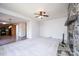 Open-concept living room with stone fireplace flows into adjacent kitchen at 538 30Th Avenue Ne Cir, Hickory, NC 28601