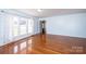 Inviting living room with gleaming hardwood floors and large windows offering plenty of sunlight at 538 30Th Avenue Ne Cir, Hickory, NC 28601