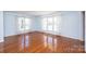 Bright and airy living room featuring gleaming hardwood floors and lots of natural light from large windows at 538 30Th Avenue Ne Cir, Hickory, NC 28601