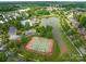 Community amenities featuring tennis courts, a lake with a fountain, clubhouse and pool area at 561 Keystone Nw Ct, Concord, NC 28027