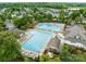 Expansive community pool area featuring lap lanes, lounge chairs, and meticulously kept landscaping at 561 Keystone Nw Ct, Concord, NC 28027