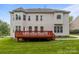 This home features a spacious wooden deck perfect for outdoor entertaining, plus a walkout basement and lush green yard at 561 Keystone Nw Ct, Concord, NC 28027