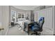 Bedroom featuring a dark color palette, carpet, bay windows, a desk, and a large closet at 561 Keystone Nw Ct, Concord, NC 28027