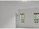Simple bedroom showcases natural light and two windows at 561 Keystone Nw Ct, Concord, NC 28027