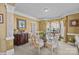 Chic dining room featuring elegant furnishings, including a glass table and bay windows at 561 Keystone Nw Ct, Concord, NC 28027