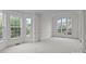 Spacious, bright room with large windows, neutral carpet, and decorative molding at 561 Keystone Nw Ct, Concord, NC 28027