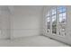 Bright, airy room with large windows, neutral carpet, and decorative molding at 561 Keystone Nw Ct, Concord, NC 28027