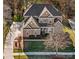 Impressive two-story brick home with lush front lawn and a classic architectural style at 561 Keystone Nw Ct, Concord, NC 28027