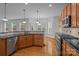 Kitchen featuring a breakfast nook, stainless steel appliances, and wooden cabinetry at 561 Keystone Nw Ct, Concord, NC 28027