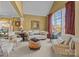 Bright and airy living room with large windows, neutral decor, and comfortable seating arrangements at 561 Keystone Nw Ct, Concord, NC 28027