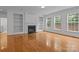 Bright living room boasts a fireplace and custom built-in bookshelves at 561 Keystone Nw Ct, Concord, NC 28027
