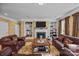 Spacious living room with a cozy fireplace, built-in shelves, and comfortable seating at 561 Keystone Nw Ct, Concord, NC 28027