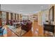 Open-concept living room and kitchen area with hardwood floors and ample natural light at 561 Keystone Nw Ct, Concord, NC 28027
