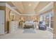 This main bedroom is spacious with a decorative trey ceiling, carpet flooring, and a sunny window at 561 Keystone Nw Ct, Concord, NC 28027