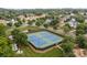Aerial view of the tennis courts surrounded by lush landscaping at 561 Keystone Nw Ct, Concord, NC 28027