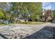 Spacious backyard featuring a basketball court and seating, perfect for outdoor activities and entertaining at 642 W Front St, Statesville, NC 28677