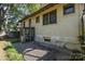 Backyard brick patio featuring a small sunroom at 642 W Front St, Statesville, NC 28677