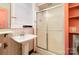 Bathroom features pedestal sink and stand up shower at 642 W Front St, Statesville, NC 28677