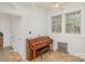 Bonus room features tiled floor, natural light and a piano at 642 W Front St, Statesville, NC 28677
