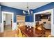 Elegant dining room featuring a stylish chandelier and ample space for hosting gatherings and dinners at 642 W Front St, Statesville, NC 28677