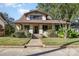 Charming two-story home with a landscaped front yard and inviting walkway to the front door at 642 W Front St, Statesville, NC 28677