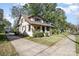 Quaint home featuring a well-maintained lawn and inviting driveway, perfect for a Gathering at 642 W Front St, Statesville, NC 28677