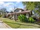 Inviting home exterior with lush landscaping and mature trees, offering a serene and private setting at 642 W Front St, Statesville, NC 28677