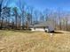 Spacious backyard view with a home and surrounding trees at 733 Baker St, Kannapolis, NC 28081