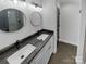 Stylish bathroom with double vanities, modern lighting, and luxurious shower at 733 Baker St, Kannapolis, NC 28081