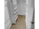 Spacious walk-in closet with built-in shelving for optimal storage at 733 Baker St, Kannapolis, NC 28081