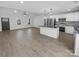 View of modern kitchen and island featuring stainless steel appliances and wooden floors at 733 Baker St, Kannapolis, NC 28081