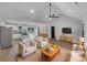 Staged living room and kitchen area featuring modern decor and stainless steel appliances at 733 Baker St, Kannapolis, NC 28081