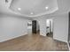 Bright bedroom with minimalist decor, recessed lighting, and wood-look floors at 733 Baker St, Kannapolis, NC 28081