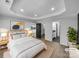 Serene bedroom featuring tray ceilings, recessed lighting, and ensuite bathroom at 733 Baker St, Kannapolis, NC 28081
