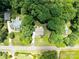 Aerial view of the home surrounded by lush trees and other homes in the neighborhood at 821 Lynnwood Farms Dr, Fort Mill, SC 29715