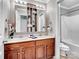 Bathroom features double sink vanity, medicine cabinet, and combination tub and shower at 821 Lynnwood Farms Dr, Fort Mill, SC 29715