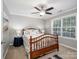 Bedroom boasts a ceiling fan, neutral walls, a double bed, and natural lighting at 821 Lynnwood Farms Dr, Fort Mill, SC 29715