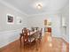 Elegant dining room with hardwood floors, wainscoting, and stylish decor at 821 Lynnwood Farms Dr, Fort Mill, SC 29715