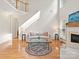 Bright and airy living room with hardwood floors, high ceilings, and fireplace feature at 821 Lynnwood Farms Dr, Fort Mill, SC 29715