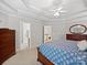 Comfortable main bedroom showcases tray ceilings and ample natural light from the large windows at 821 Lynnwood Farms Dr, Fort Mill, SC 29715
