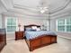 Spacious main bedroom features a tray ceiling, dual windows, and a large bed at 821 Lynnwood Farms Dr, Fort Mill, SC 29715