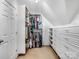 Spacious walk-in closet with custom shelving, drawers, and ample hanging space at 821 Lynnwood Farms Dr, Fort Mill, SC 29715
