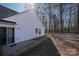 Spacious backyard featuring a patio area and lush greenery, perfect for outdoor entertaining at 8421 Kings Creek Dr, Charlotte, NC 28273