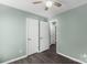 Bedroom with closets, hardwood floors, and ample lighting at 8421 Kings Creek Dr, Charlotte, NC 28273