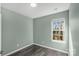 Bright bedroom with hardwood floors and a sunlit window at 8421 Kings Creek Dr, Charlotte, NC 28273