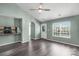 Inviting living room with natural light, eat-in bar to kitchen, and attractive front door at 8421 Kings Creek Dr, Charlotte, NC 28273