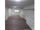 Spacious basement area with durable wood-look flooring and ample storage, ready for customization at 927 Locke St, Salisbury, NC 28144